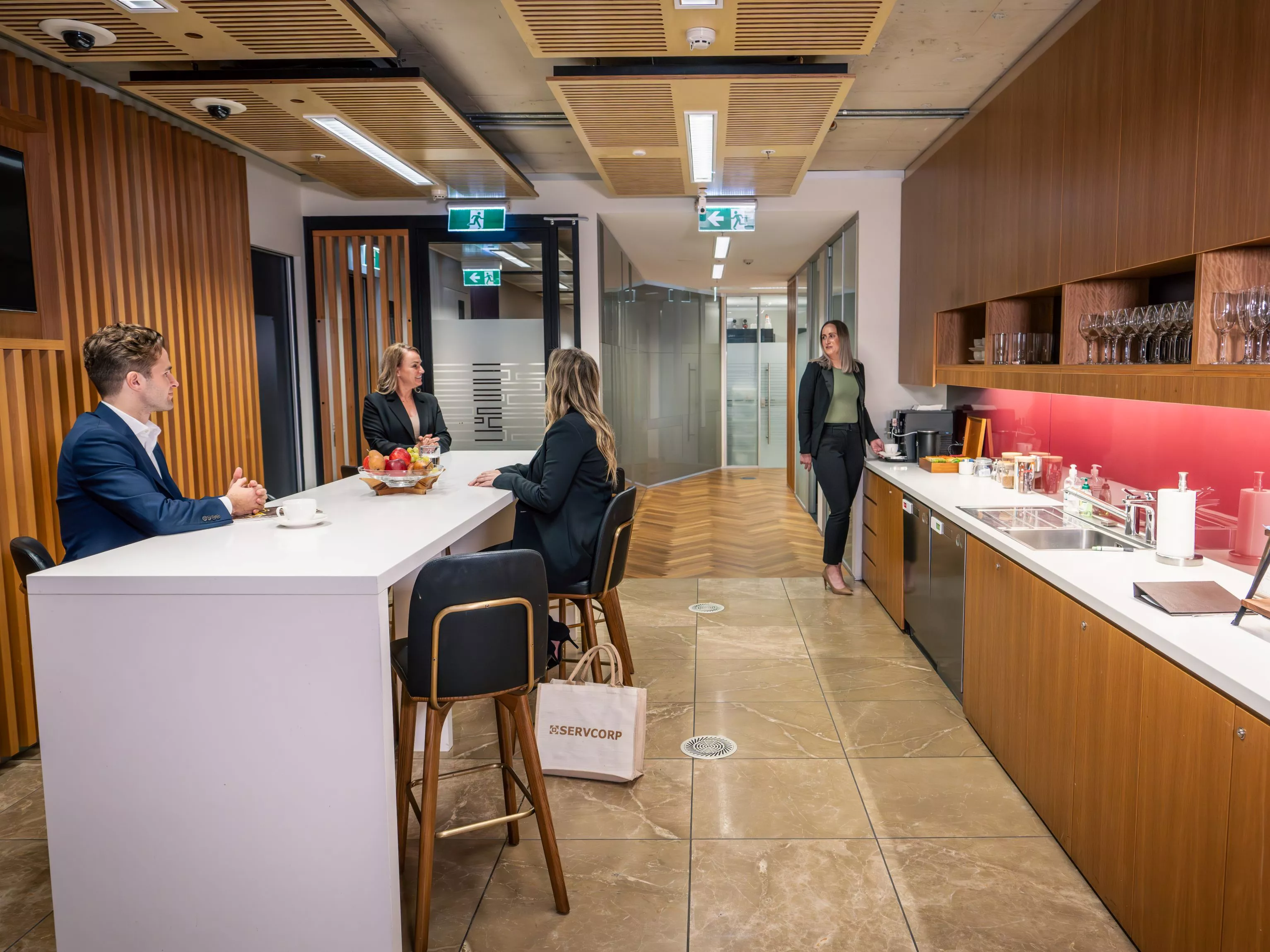 Clients enjoying the fully stocked kitchen in Servcorp Nishi Building, Canberra