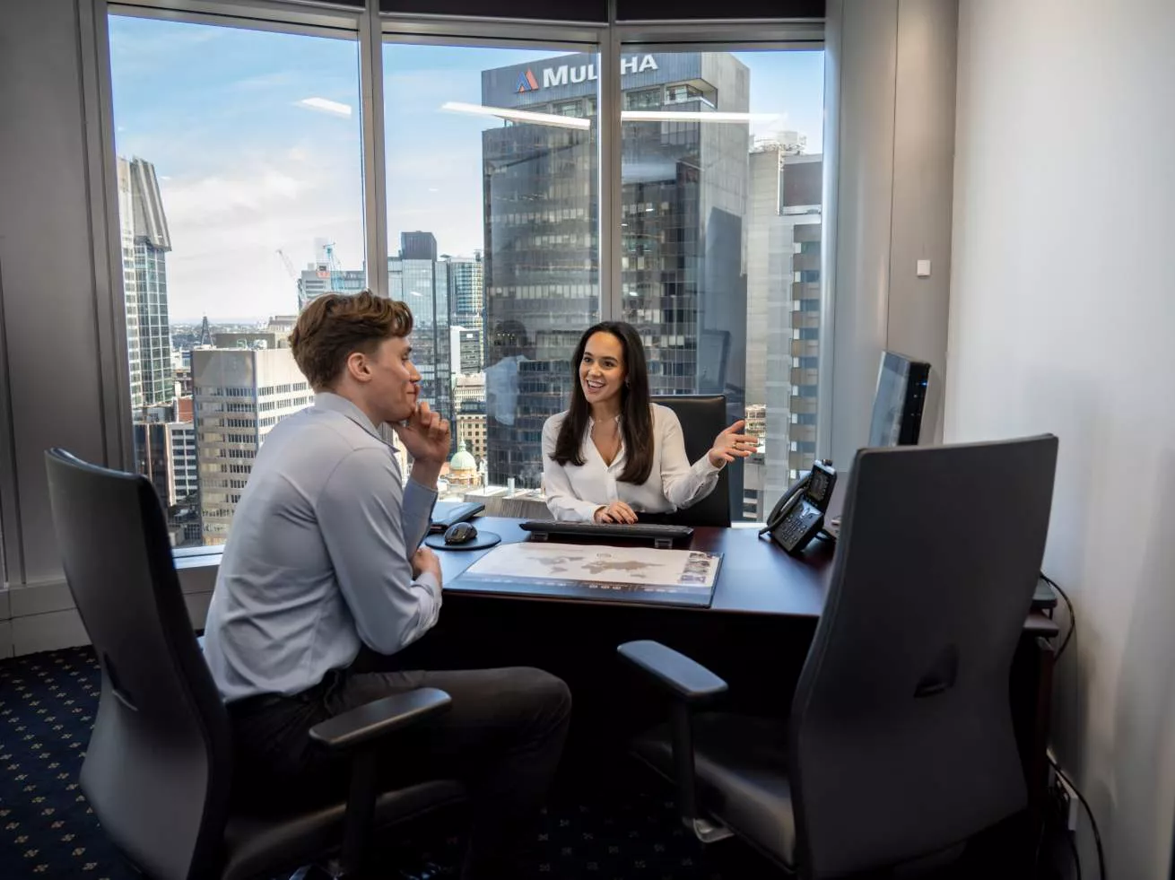 Clients in a private, servived offices with an impressive view in Servcorp Chifley Tower