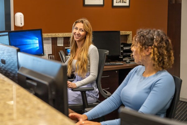 personal assistants discussing at work