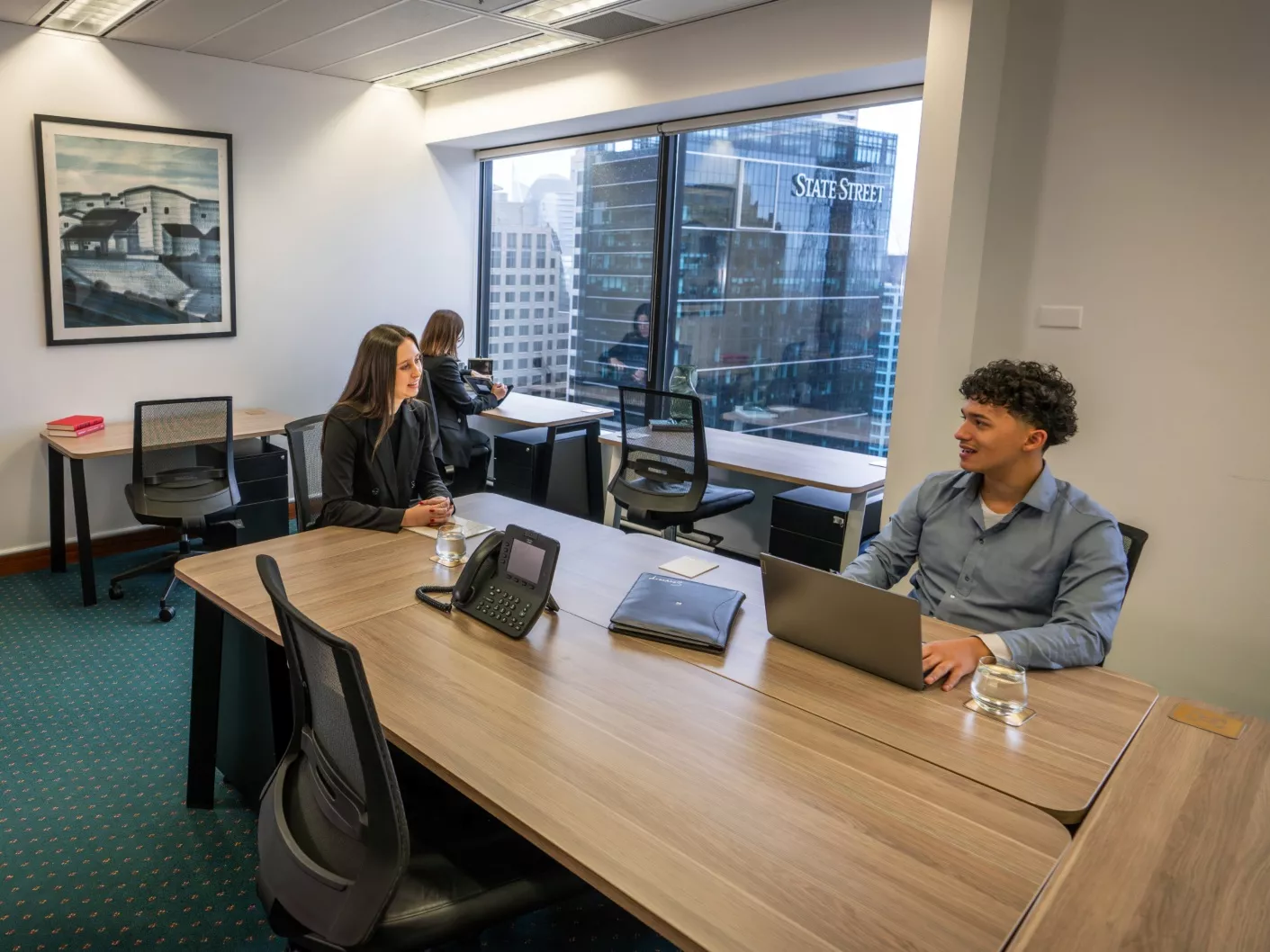 Fully fitted private modern Serviced Office with clients working in it in Servcorp 44 Market Street