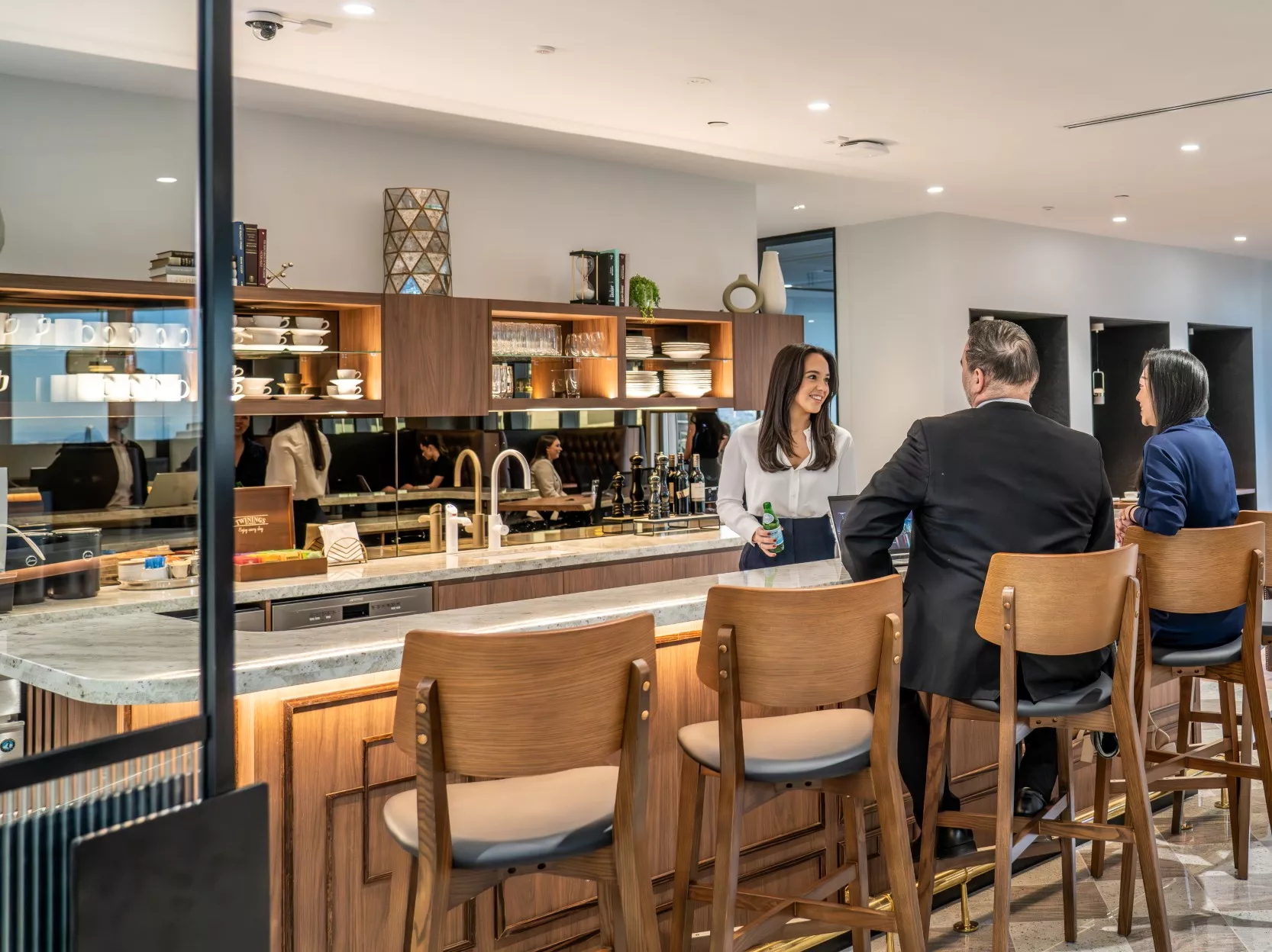Clients enjoying their time in a modern coworking space break room in Servcorp Chifley Tower