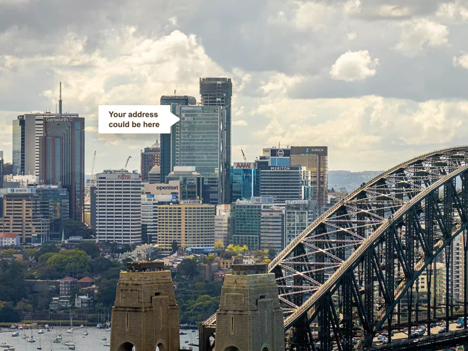 Drone overlooking the Sydney harbour bridge with Servcorp 100 Mount Street in the background